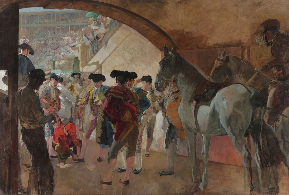 view under an archway into an open-air arena; group of matadors wearing colorful outfits and black hats; three horses at…