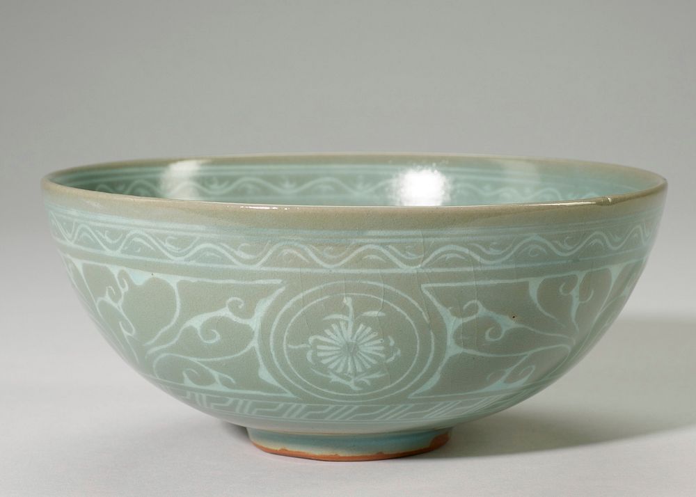 Bowl, Celadon ware, soft gray green glaze decorated inside with medallion surrounded by three others. Three medallions on…