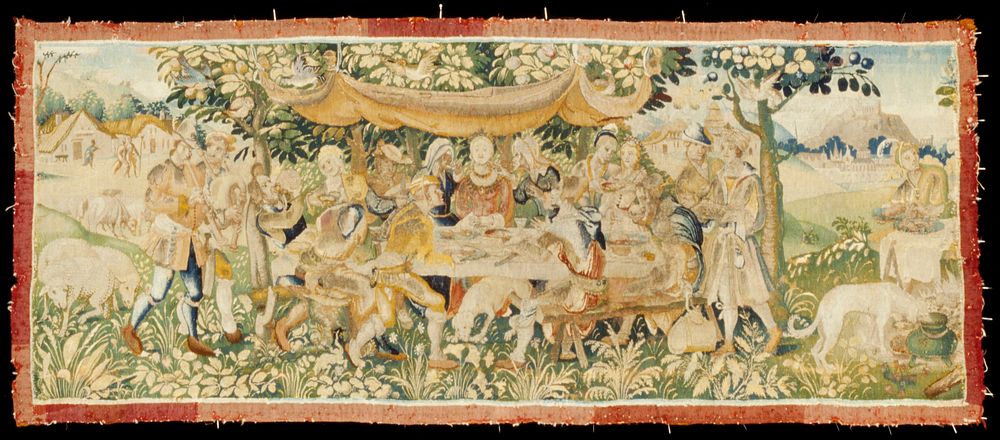 Tapestry panel, showing a hunting party feasting at a table under a tree, from which a canopy is suspended, and is attended…
