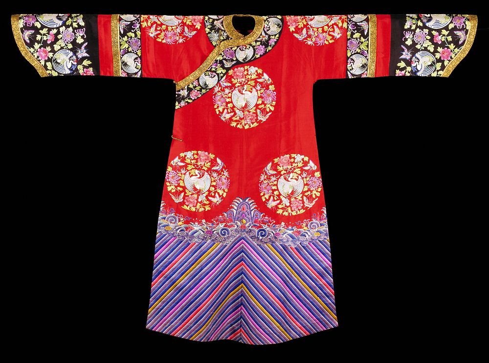 Robe of red twilled silk embroidered with eight large medallions containing cranes, butterflies, chrysanthemum and peony…