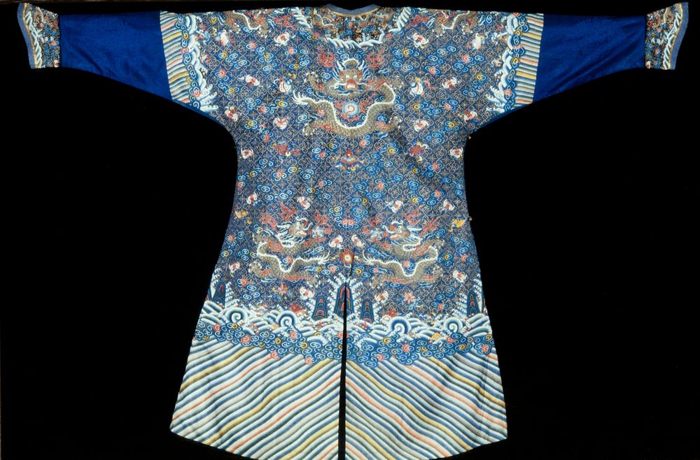 Court robe of dark blue k'ossu with diaper back ground of narcissus blossoms and swastikas, enclosed in quatrefoil; scepter…