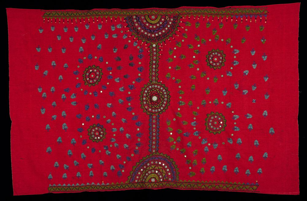 red fabric with green, blue and black embroidery; red and gold colored couching threads; mirrors in circle motifs; other…