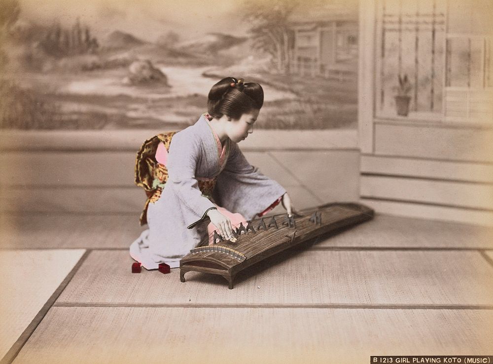 Young girl wearing a lavender kimono and a yellow and red obi playing a stringed zither-like instrument. Original from the…