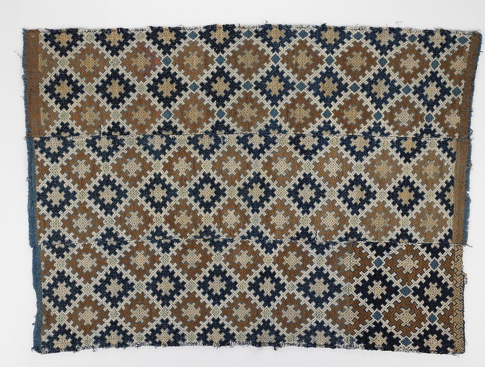 4 woven panels sewn together; geometric linear diamond design with brown, tan, white, light green and dark blue on medium…