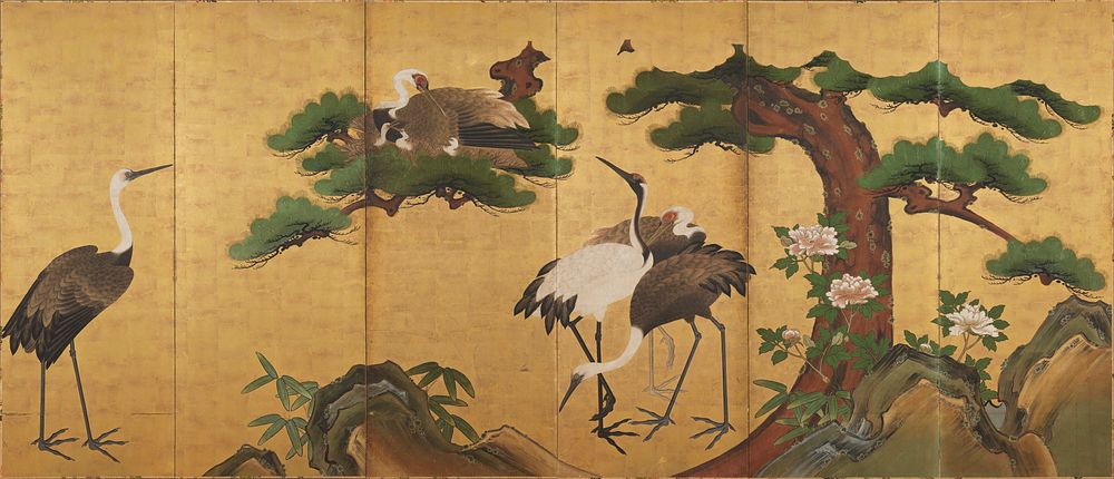 Family of cranes under the boughs of a pine tree against gold background; rocks and bamboo leaves along bottom; peony…
