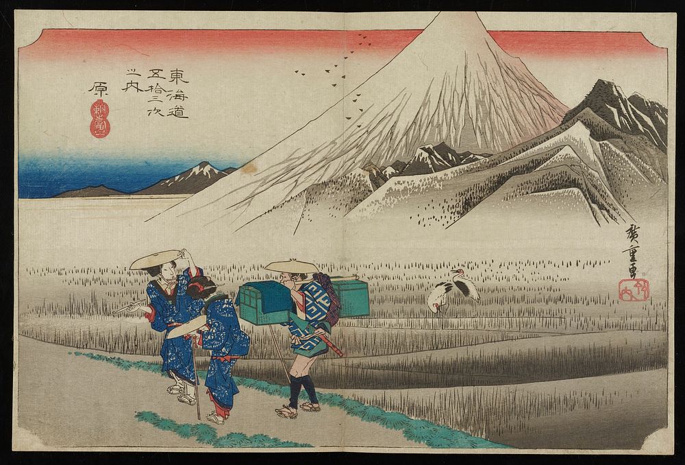 Mt. Fuji in background; grayish rice fields with two cranes in middle ground; three travelers standing in a group at L, one…