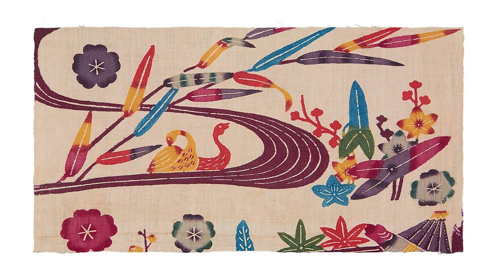 rectangular fragment of white fabric with river scene and floral designs; pink river curves through L and C with two ducks…