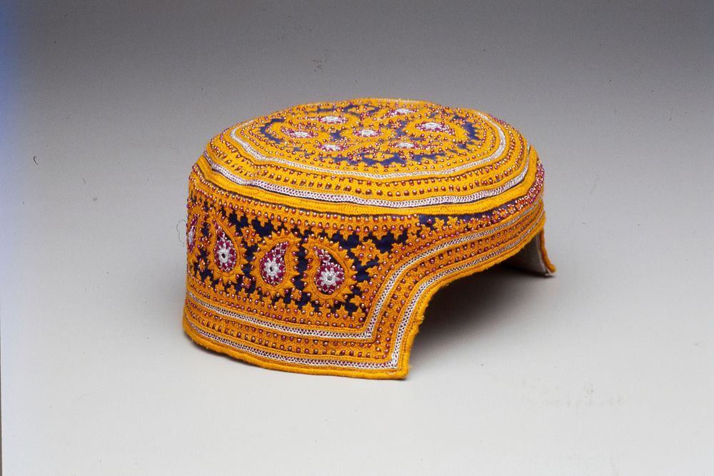 orange design on blue ground; fiscia beads throughout; silver colored trim; baluchistan. Original from the Minneapolis…
