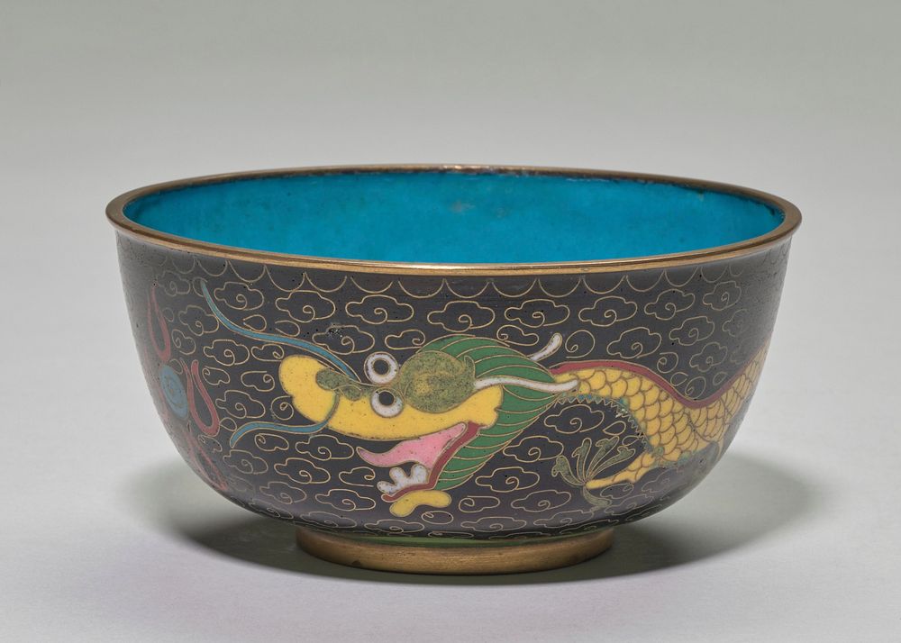 Cloisonne bowl; gold rim and base, blue interior; exterior, black ground with gold small cloud patterning in background, two…