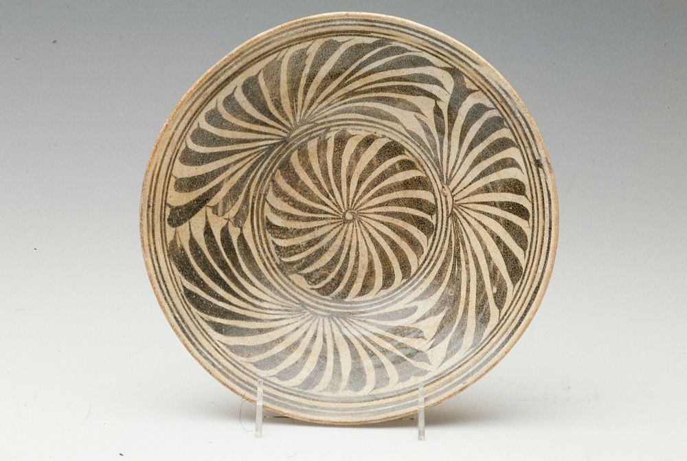 Shallow Bowl, Kalong ware; brown underglaze with iron black design; porcelaneous stoneware.. Original from the Minneapolis…
