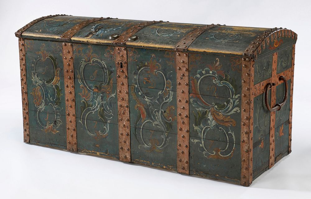 Chest with five painted and studded iron bands; painted blue with organic designs between bands; large c-shaped handles; key…