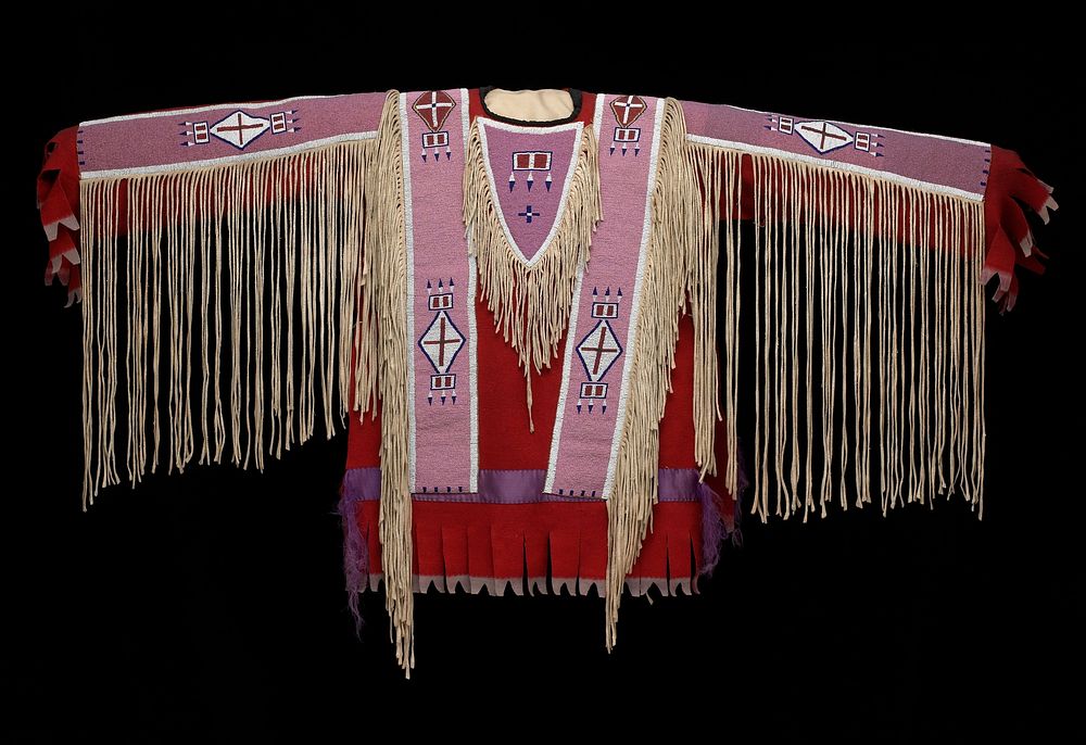 red felt shirt with beaded panels across each shoulder, on upper back and on top of each arm; fringe at edges of beaded…