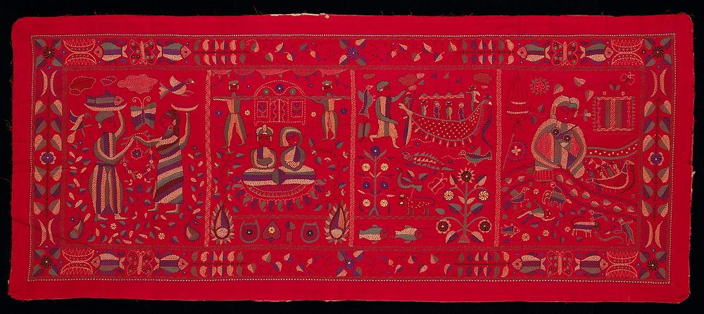 red cloth with four panels each containing a stitched scene with various people, animals, plants and designs; rectangular…