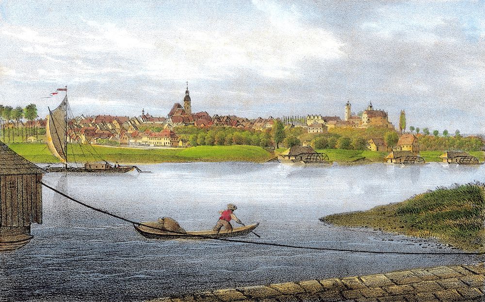 The miller from Lorenzkirch leaves his shipmill at the river Elbe with flour bags in his rowboat. In the background are…