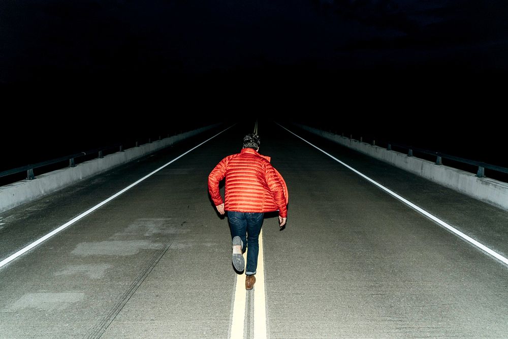 Free man running in the road image, public domain night CC0 photo.