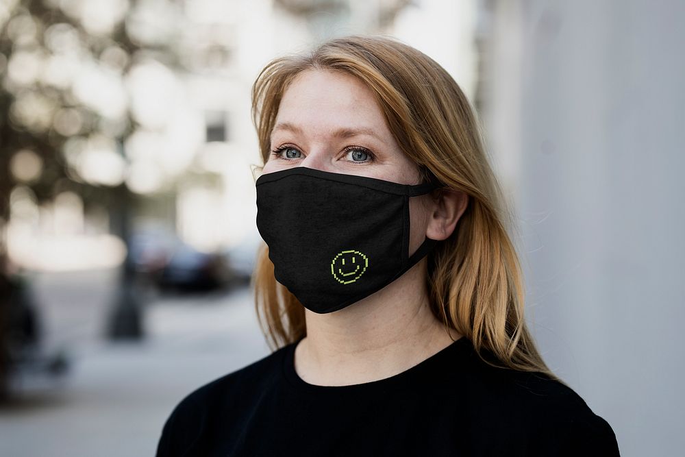 Blonde woman wearing face mask, COVID-19 protection