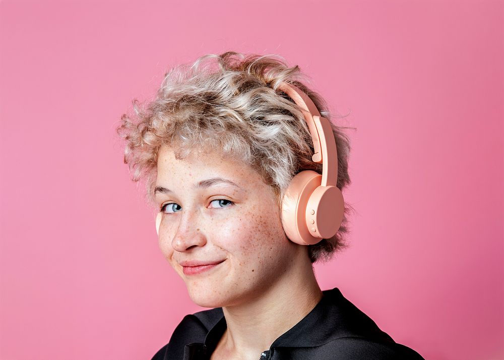 Girl with pink headphones on