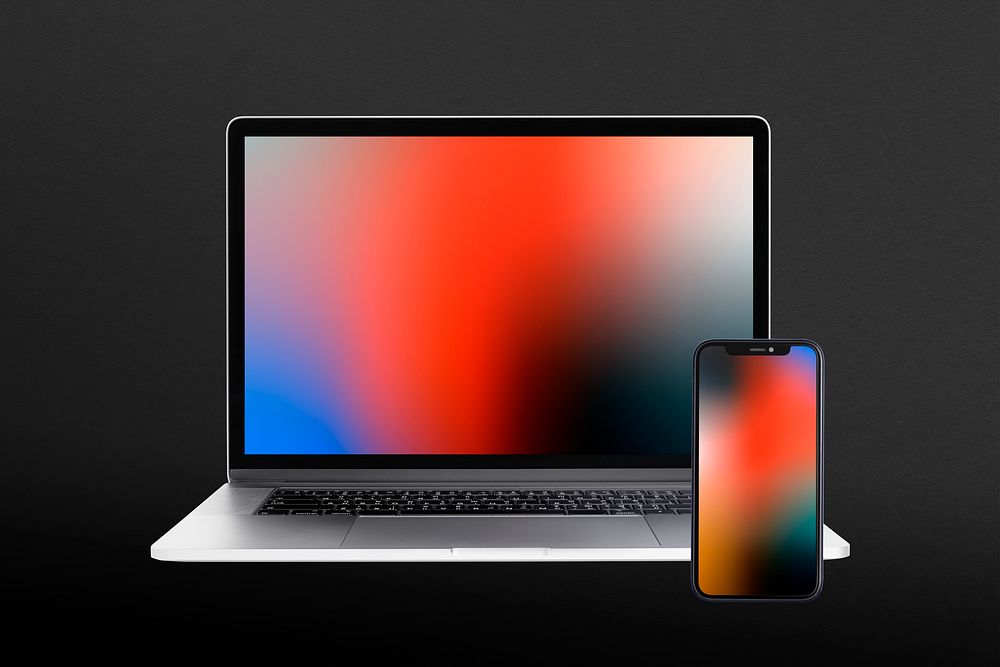 Digital device screen with laptop and smartphone with gradient wallpapers