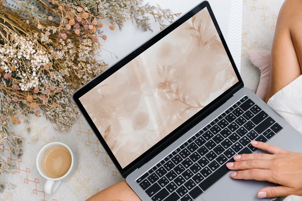 Woman using laptop, aesthetic workspace