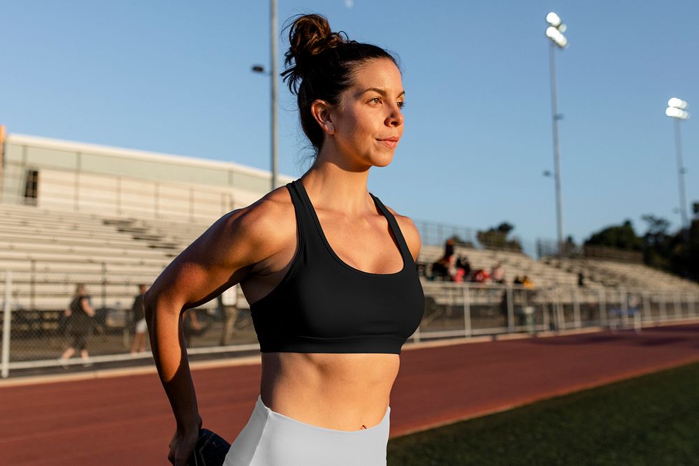 Woman stretching on running track