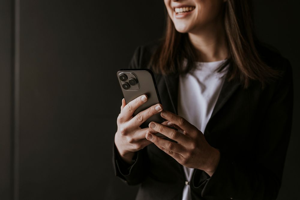 Businesswoman texting on her phone