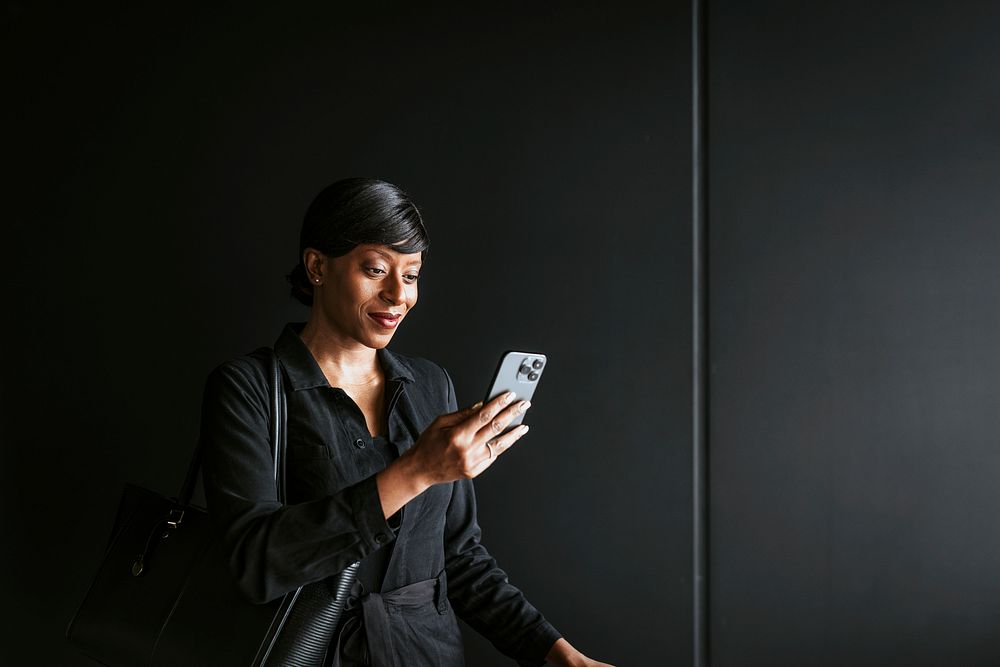 Woman using smartphone, business trip