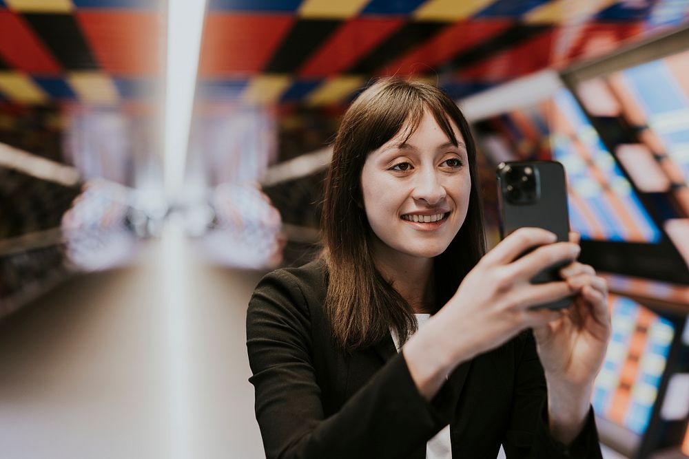 Woman taking photo with smartphone