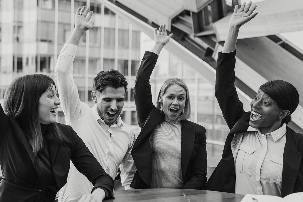 Business colleagues raising hands, teamwork photo