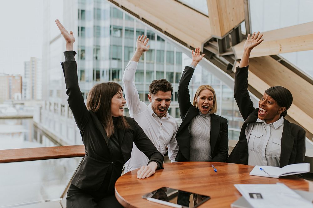 Business colleagues raising hands, teamwork photo