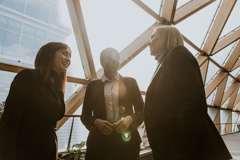 Diverse businesswomen chatting during break