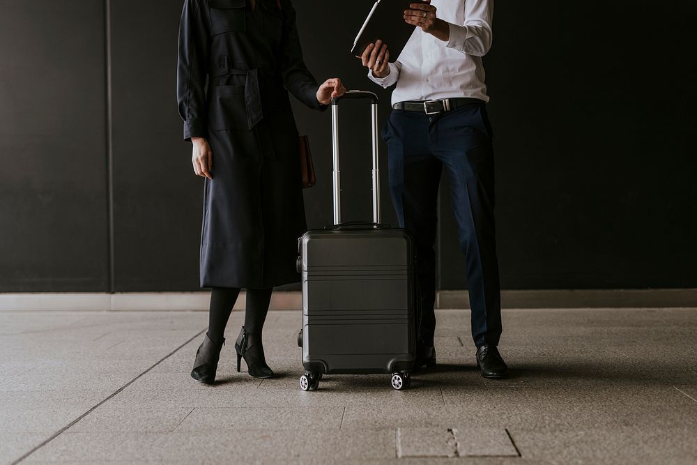 Business colleagues on a trip, using tablet