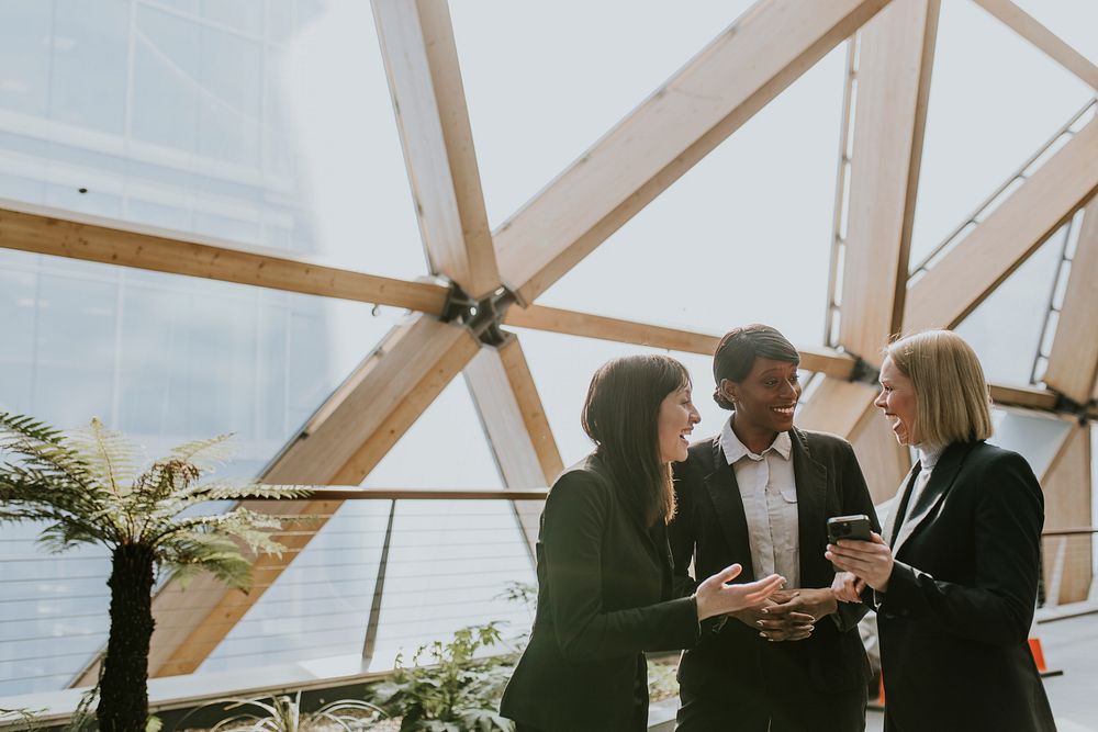 Diverse businesswomen chatting during break