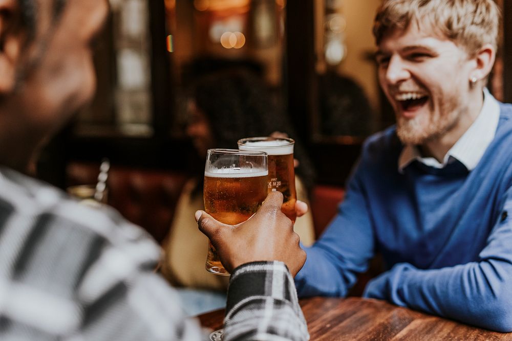 Friends toasting with beer, celebration photo