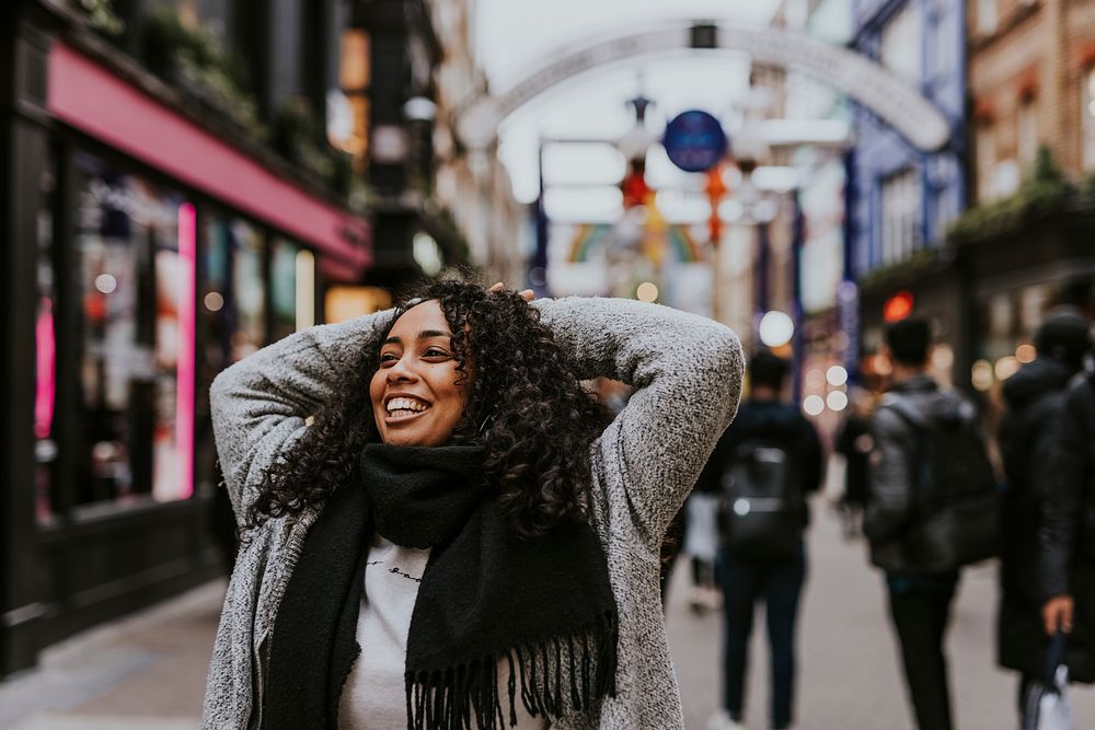 Cheerful woman walking in the city