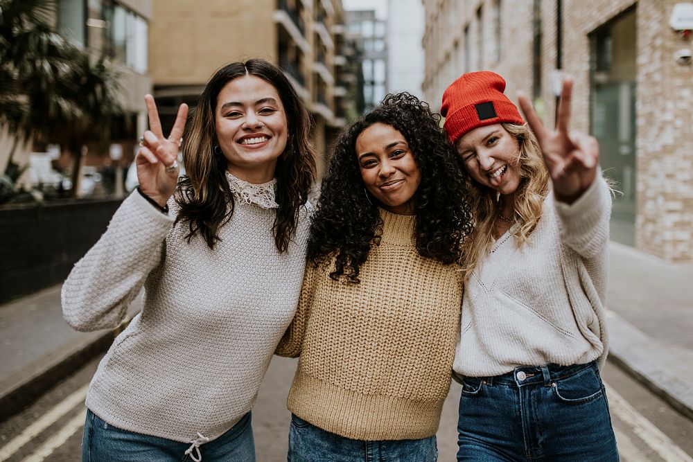 Happy girl friends hanging out in the city