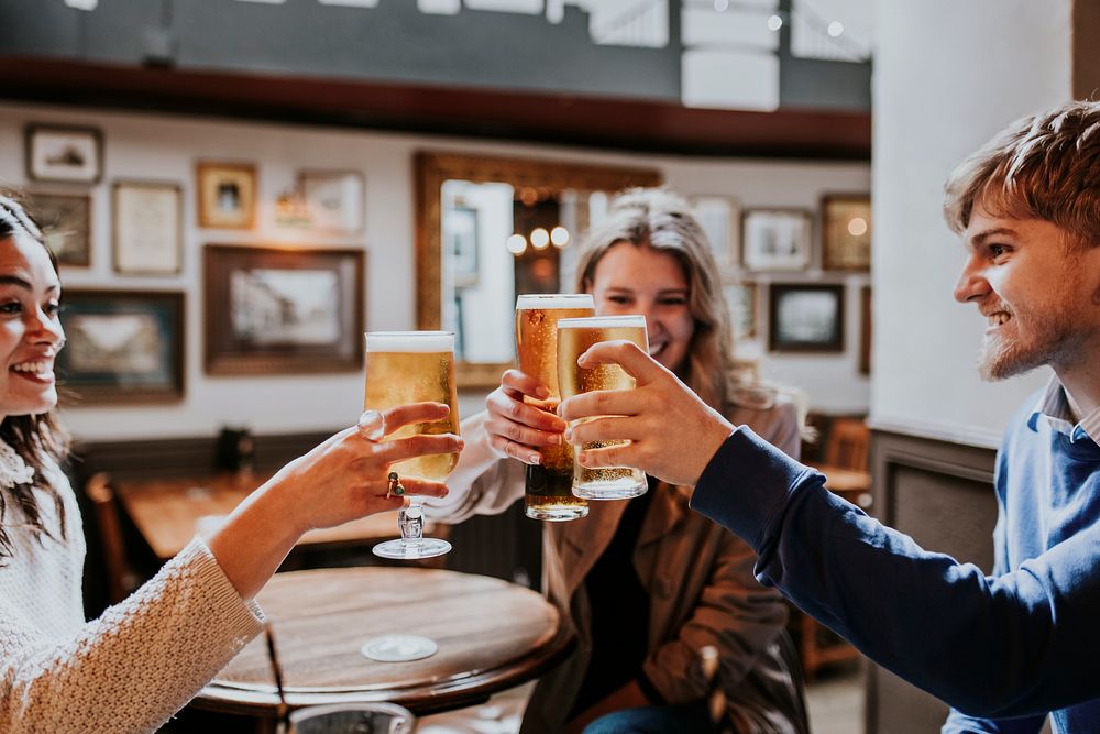 Friends cheering beer glass, celebration photo