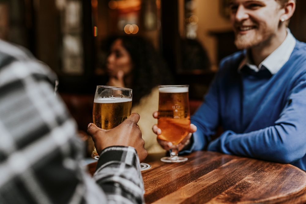 Friends toasting with beer, celebration photo