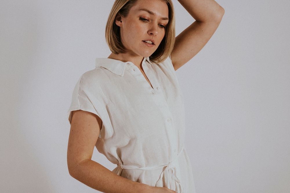 Woman wearing white linen dress, minimal fashion