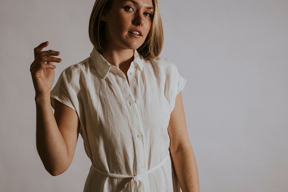 Woman wearing white linen dress, minimal fashion