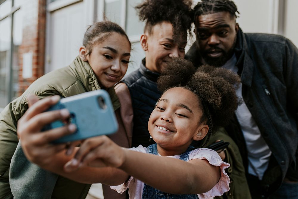 Happy African-American family taking selfie