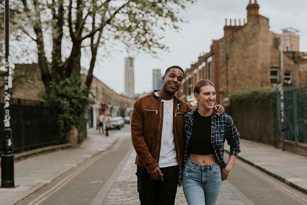 Diverse couple on a date, walking in the city