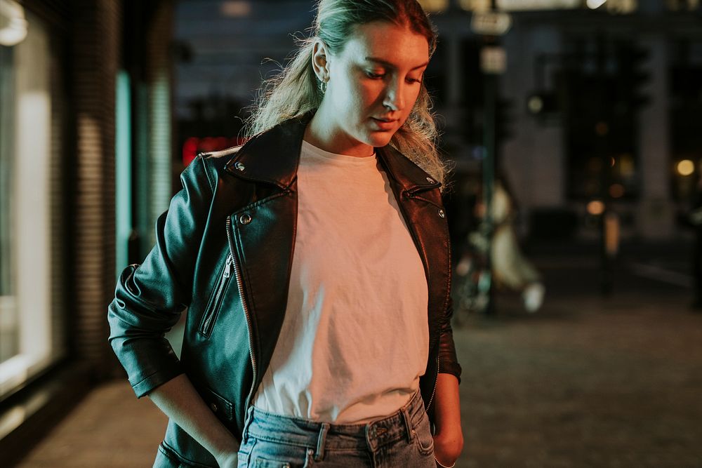 Woman wearing black leather jacket, street fashion