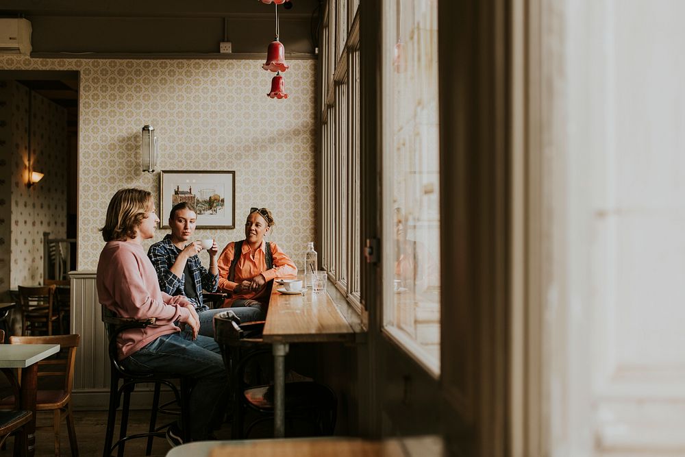 Diverse friends having morning coffee at a cafe