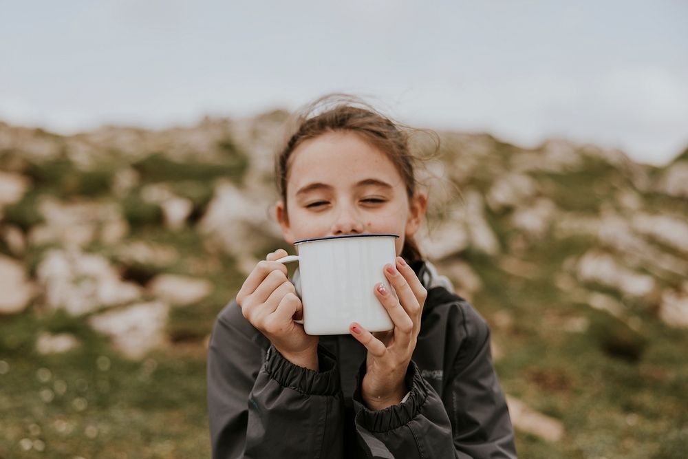 Camping girl drinking hot tea