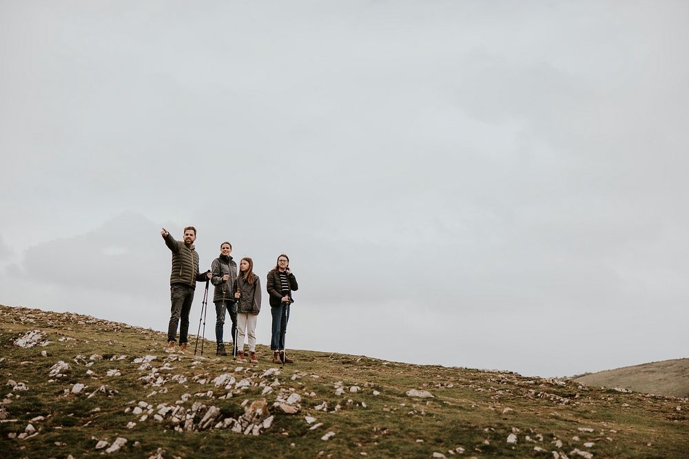 Family hiking on mountain, outdoor activity