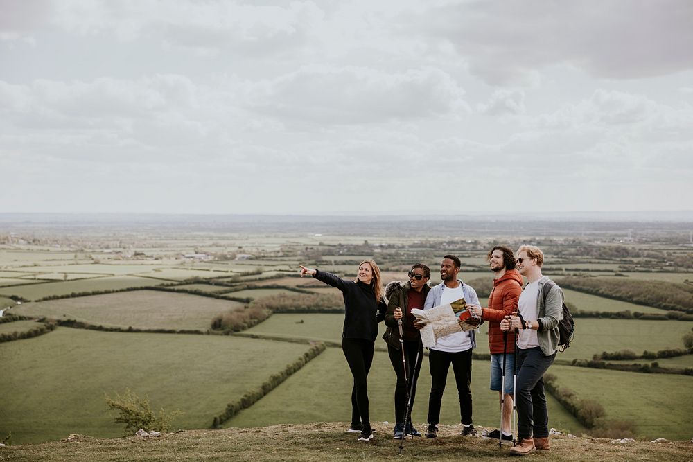 Group of friends traveling on hill photo
