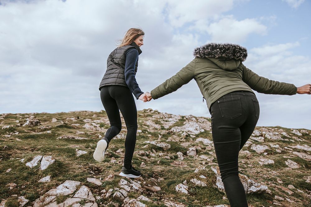 Happy women hiking together, outdoor activity