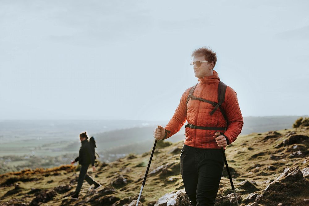 Man hiking on mountain, outdoor activity photo
