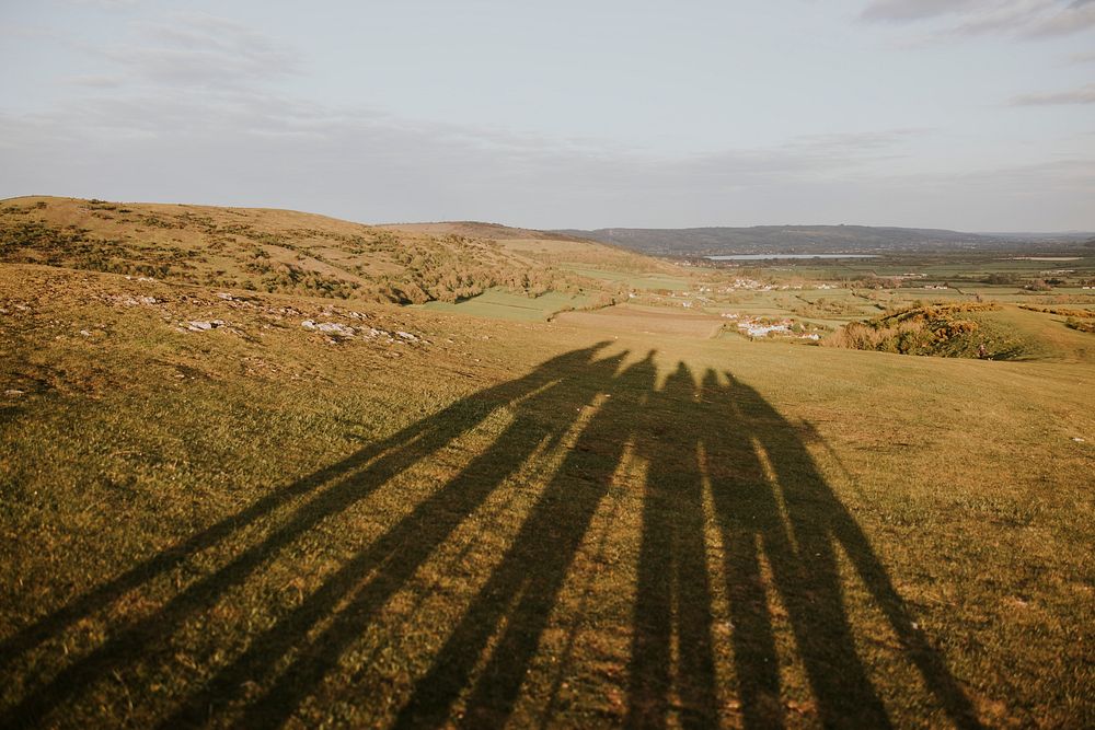 Hikers shadow on hill, outdoor activity photo