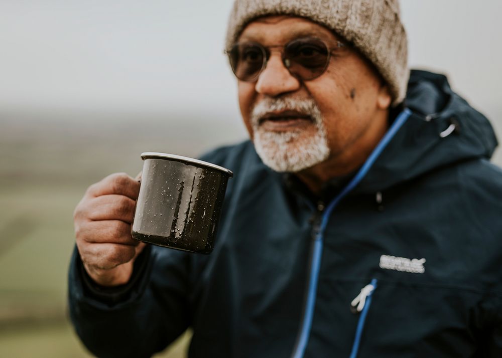 Senior camping man drinking coffee